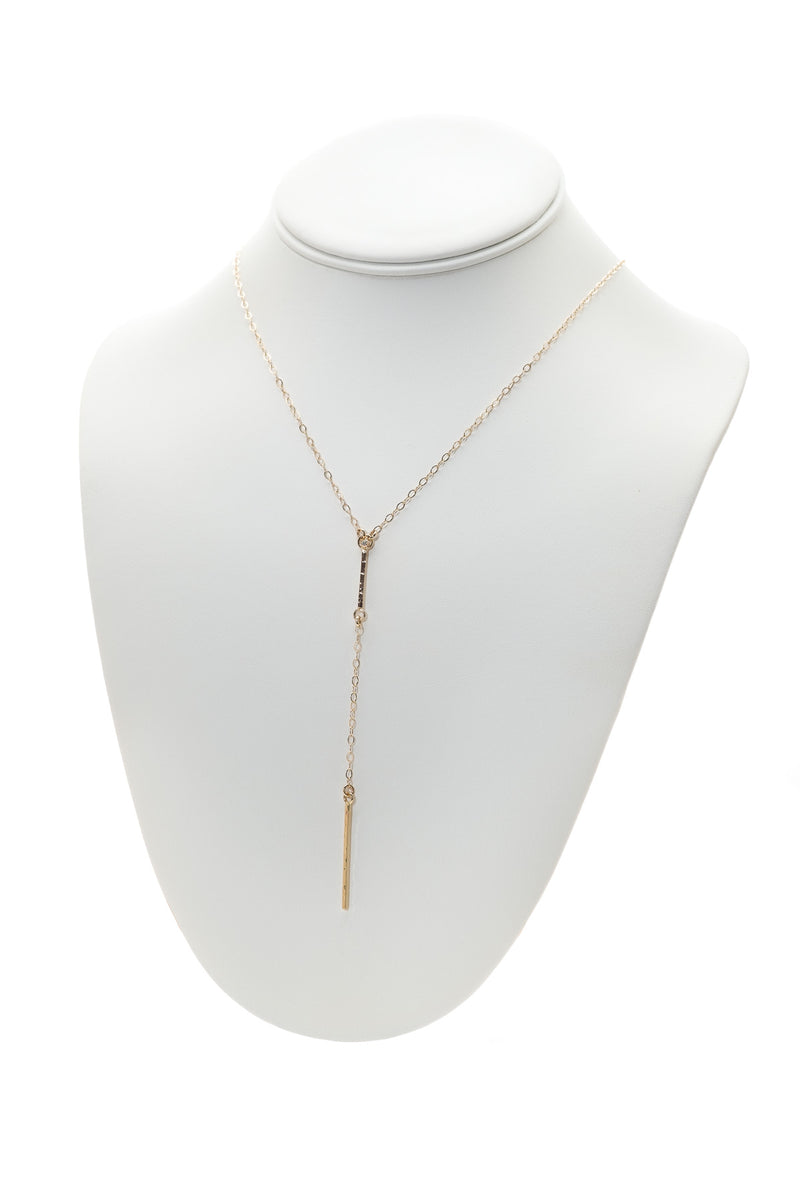 14k Gold Bar Lariat Necklace with Diamond Accent on a neck display
