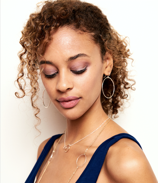 Model wears the 14k Gold Filled large circle earrings with the interlocking circle necklace