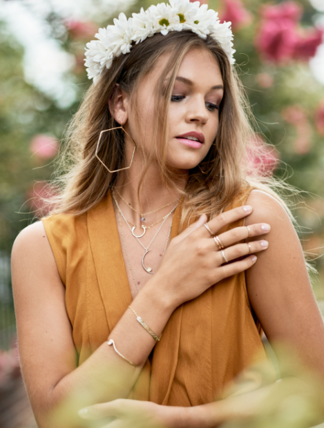 Modeal wears the Lucky Charm necklace with Hexagon Hoops and Trillion Necklace
