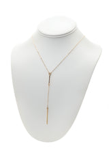 14k Gold Bar Lariat Necklace with Diamond Accent on a neck display