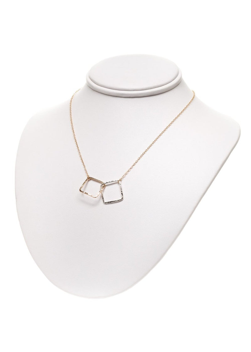 Two tone interlocking squares necklace on a neck display
