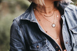 Model wears the Everyday Chain Gwen Necklace with Coin Necklace, 10 Disc Talia Lariat and Rectangle choker Necklace