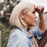 Model wears the Hexagon Spike Studs with Lightning Bolt Stud earrings and Bangle bracelets