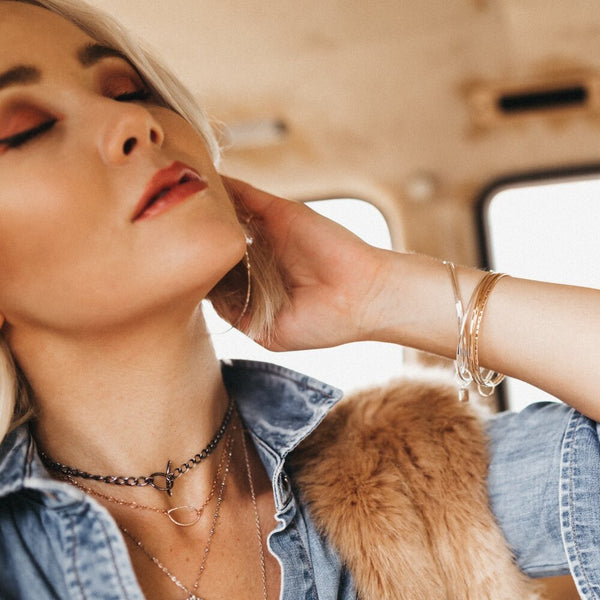 Model layers the marquis necklace with the Janis chain choker