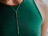 Model wears the PuuR Bar Lariat Necklace with Diamond Accent