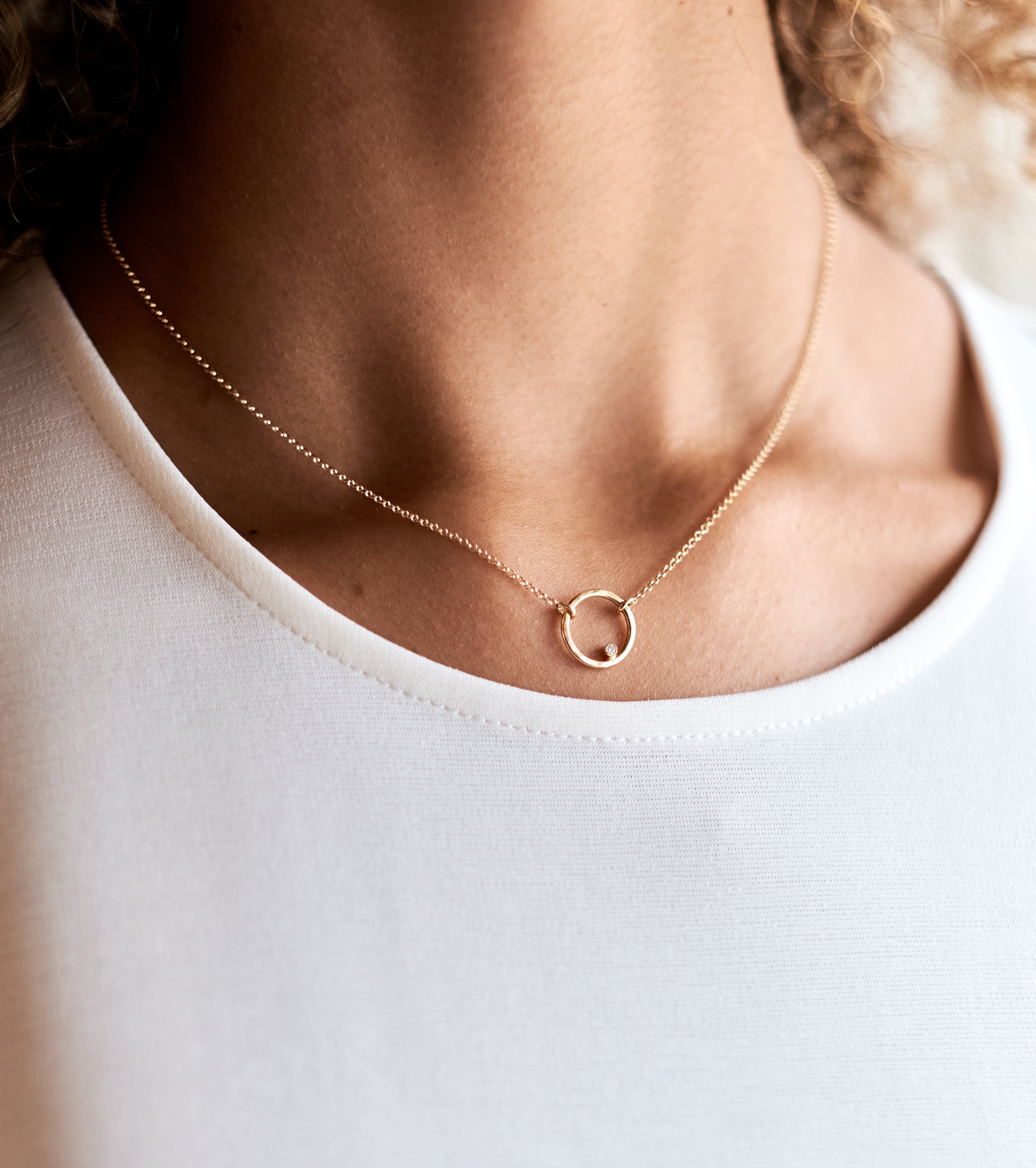 Model wears the 14k Gold Rolloette Necklace with Diamond Accent