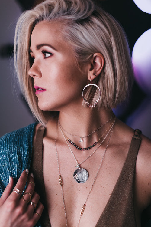 Model wears The Blondie Hoop with Trillion necklace, Gwen Chain necklace and Medallion Necklace