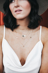 Model wears the layering chain with the half moon necklace and three disc necklace