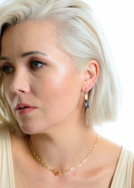 Model pairs the Kenda Kist Rectangle Crystal earrings with a paperchain toggle necklace