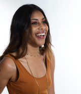 Model layers the Five Star Chocker Necklace with a long layer chain