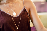 Model wears Long Necklace with Dainty Disc Charms with Medallion Necklace and Talia Five Disc Necklace
