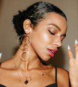 Model wears the Sunnies hoop earrings with Tiny Star Suds, Deco pendant and Talia 10 Disc Long Necklace