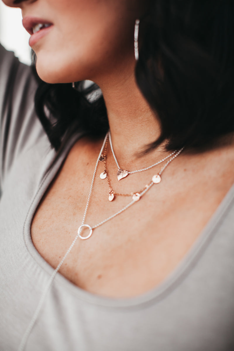 Model layers Talia Five Disc Necklace with Heart Choker Necklace and Circle Stick Lariat