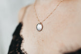 Close up of the Two-tone Sterling Silver coin pendant on a 14k Gold Filled Chain necklace 