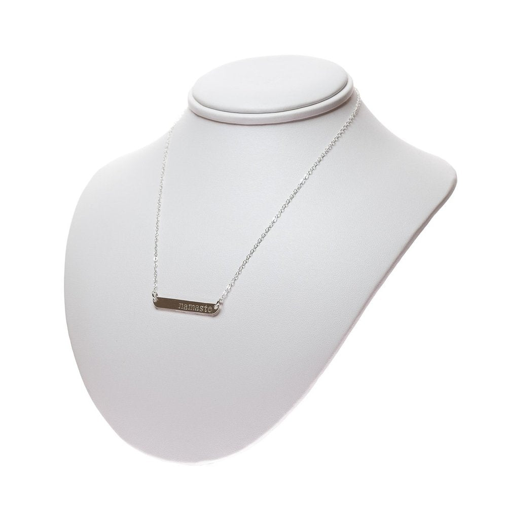 Sterling Silver Namaste word place necklace on a neck display