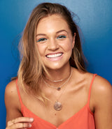 Model wears the Kenda Kist Closed wire hoops with layers of 14k Gold Filled necklaces